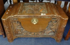 A carved Chinese blanket chest.