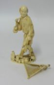 A carved ivory figure of a fisherman height 13cm