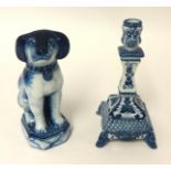 A Makkum porcelain dog group and a similar single candle stick (2)