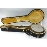 A Clifford Essex Paragon Concert Banjo No114 with case. Once owned by Arthur Thomas who played