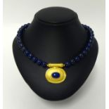 A modern Egyptian gold & lapis lazuli necklace, length 45cm.