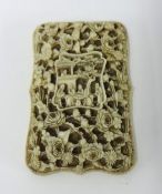 A fine 19th century Chinese carved ivory card case, with bow front, carved in high relief with