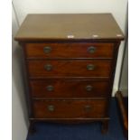 A small chest fitted with four long drawers with canted corners, width 61cm.