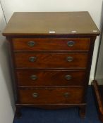 A small chest fitted with four long drawers with canted corners, width 61cm.