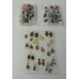 Collection of various dress rings and earrings (displayed as three packages)