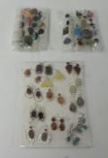 Collection of various dress rings and earrings (displayed as three packages)