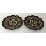 A pair of cloisonné scalloped design decorated with Dragons.