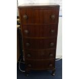 A traditional narrow chest fitted with five drawers on shaped legs.