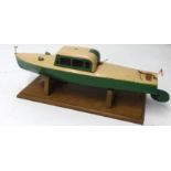 A Hornby 1940's clockwork cabin cruiser 'The Venture' on plinth