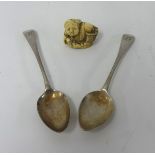 Two Georgian silver teaspoons and a carved ivory Netsuke.