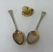 Two Georgian silver teaspoons and a carved ivory Netsuke.