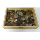 A collection of various general foreign coins in wood box.