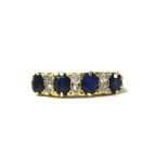 An 18ct antique sapphire and diamond ring, set with 4 blue sapphires and 8 old cut diamonds, stamped