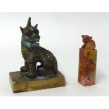 A brass seal in a form of a dog and also a soap stone seal (2)