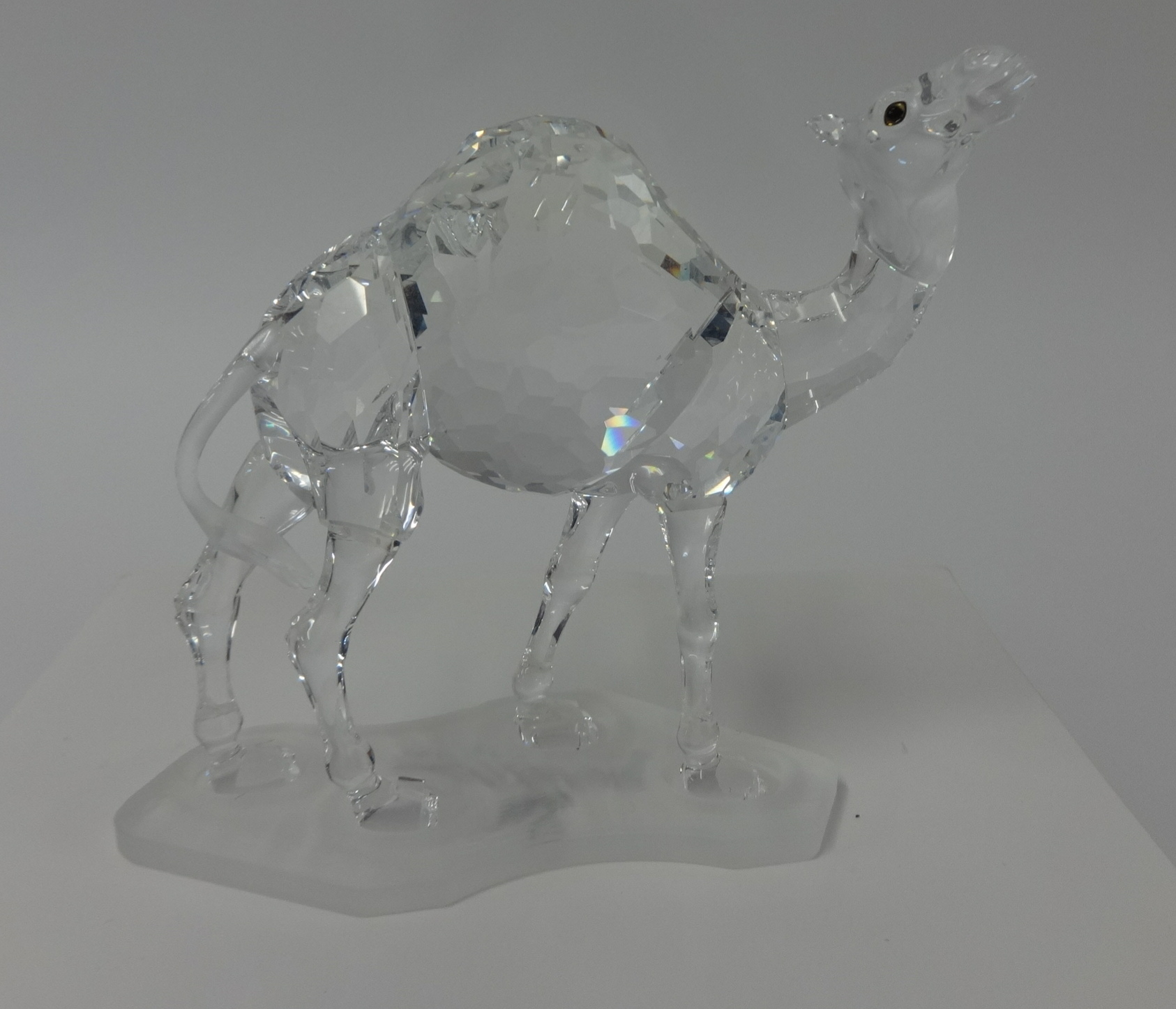 Swarovski Crystal glass Camel and stand.