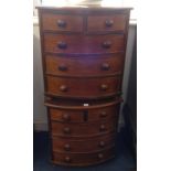 A pair of miniature mahogany bow fronted chest of drawers, width 47.5cm (2).