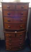 A pair of miniature mahogany bow fronted chest of drawers, width 47.5cm (2).