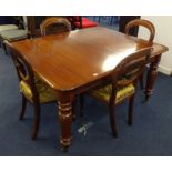 A Victorian mahogany dining table with pull out mechanism and extra leaf together with a group of