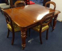 A Victorian mahogany dining table with pull out mechanism and extra leaf together with a group of