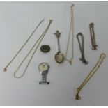 Small collection of yellow metal chains, jewellery, silver spoon and Smith's nurses watch.