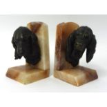 A pair marble book ends with cast bronze heads of spaniel and blood hound