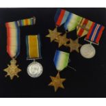 A Great War pair of medals stamped 94859 GNR. J.Ford R.F.A. also five WWII medals named including