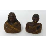 Two Kauri gum carved heads a Maori man and women, height 14cm.