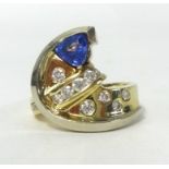 Tanzanite and diamond ring of half moon design approx. 1/2 ct of diamonds set in 14ct gold, weight