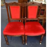 Six Edwardian dining chairs with upholstered seats and back rests.