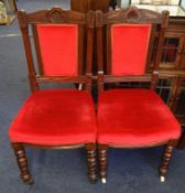 Six Edwardian dining chairs with upholstered seats and back rests.