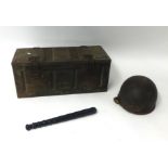 An old military box, war helmet and truncheon.