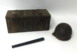 An old military box, war helmet and truncheon.