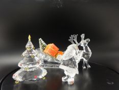 Swarovski Crystal glass Santa, Reindeer, sleigh and Christmas tree on a glass stand.