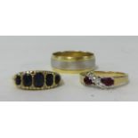 Three dress rings including 14K band ring, an a 18ct and 9ct ring (3)