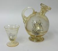 Heavy glass decanter partly frosted and decorated with a sailing ship and similar drinking glass