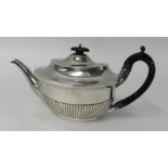 A silver teapot with half fluted body, weight approx.19oz