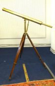 Antique brass 3 inch telescope by Davis of London, mounted on an adjustable mahogany tripod stand