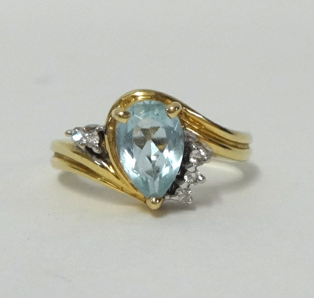 A 14k gold aqua marine and diamond mounted ring, stamped 14k and .585, size M. - Image 2 of 2