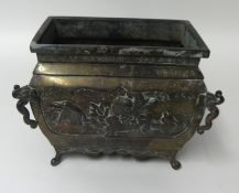 A Chinese heavy metal planter, possibly bronze, signed to base, embossed decorated with birds,