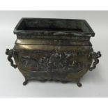 A Chinese heavy metal planter, possibly bronze, signed to base, embossed decorated with birds,