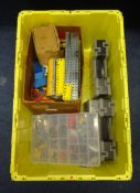 A large collection of mixed Meccano parts including plates, strips, girders, brackets, screws,