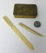 An 1842 China War Medal mounted as a brooch, a WWI Mary Tin and bone carvings.