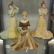 A collection of 13 porcelain figurines comprising Royal Worcester (3), Royal Doulton (5),