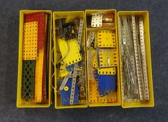 A mixed collection of Meccano parts including plates, strips, flat girders, circular parts and teeth