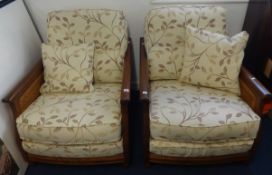 A pair of Ercol armchairs.