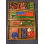 Meccano accessory outfit in a wooden box including strips, plates, ball/roller bearings, circular