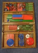Meccano accessory outfit in a wooden box including strips, plates, ball/roller bearings, circular