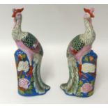 A pair of 20th century Phoenix Birds of Chinese design, height 32cm.