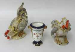 A Doulton porcelain vase and a pair of 20th century fighting cockerels (3).