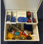 A collection of mixed Meccano parts including plates, strips, wheels, brackets etc.